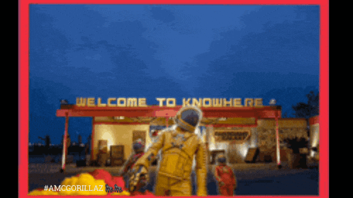 a welcome to knowhere sign with a man in a yellow suit