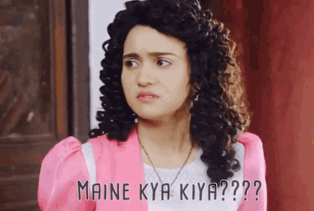 a woman in a pink jacket with the words maine kya kiya on the bottom
