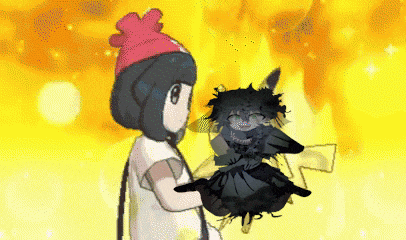 a girl in a pink hat is holding a black monster .