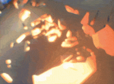 a blurred image of a person holding a piece of paper in their hands