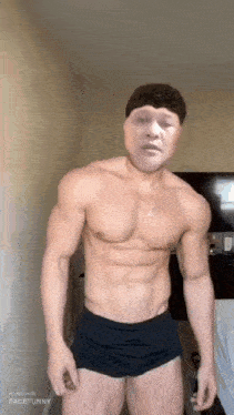 a shirtless man in black shorts is standing in a room with a fake face on his face .