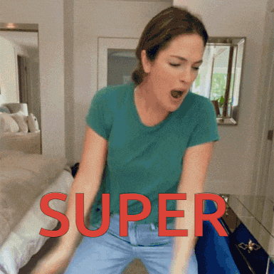 a woman in a blue shirt is sitting on a bed with the word super written in red