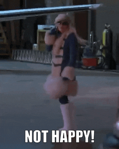 a woman in a fur coat is talking on a cell phone and says not happy