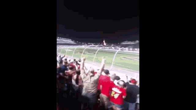 a blurry picture of a stadium with a lot of people