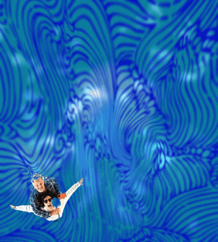a man and a woman are flying through the air with their arms outstretched
