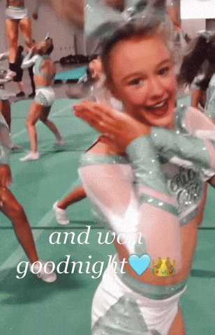 a cheerleader is smiling with the words and won goodnight written below her