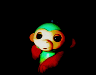 a toy monkey with a green hat and red arms