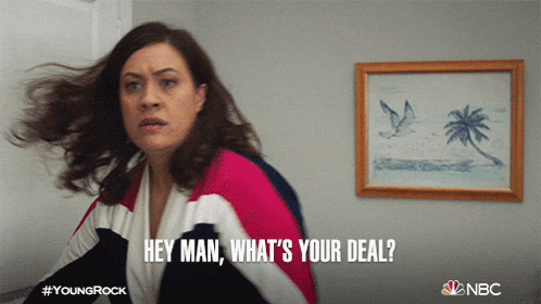 a woman says " hey man what 's your deal " in front of a picture