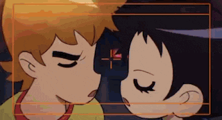 a boy and a girl are kissing with their eyes closed .