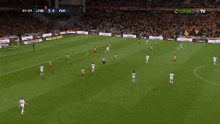 a soccer game is being played in front of a crowd and the score is 7 to 0