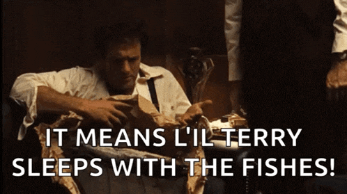 a man sitting in a chair with the words " it means l'il terry sleeps with the fishes "