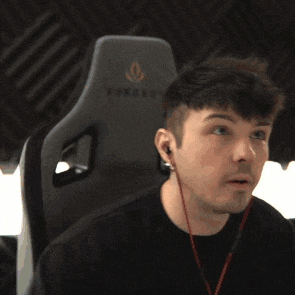 a man wearing ear buds is sitting in a chair with the word force on it