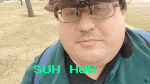 a man wearing glasses and a hat says " suh huh " on the bottom