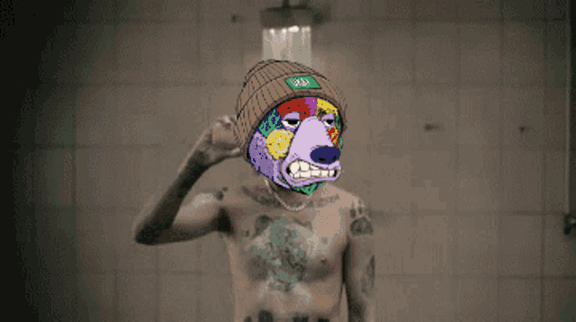 a shirtless man with a cow on his head wearing sunglasses and a hat