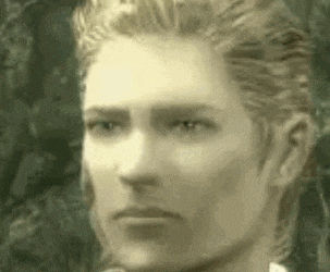 a close up of a person 's face with a serious look on their face .