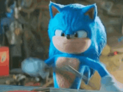 a close up of a blue sonic the hedgehog from the movie sonic the hedgehog .