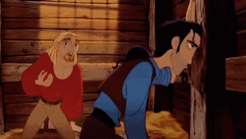 a man in a red shirt and a man in a blue shirt are standing next to each other