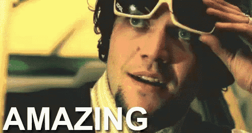 a man wearing sunglasses and a scarf has the word amazing on the bottom