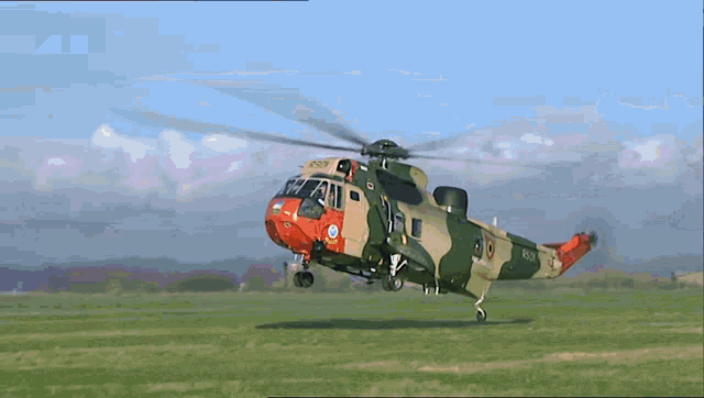 a plane 's landing gear is shown in a grassy field