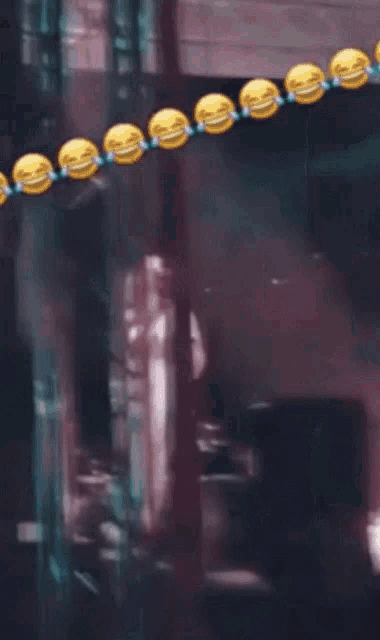 a bunch of smiley faces are hanging from a string and the word lehet is below them