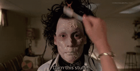 a person is applying makeup to a person 's face and says `` darn this stuff ! ''