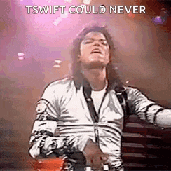 a man in a zebra print shirt is dancing on stage .