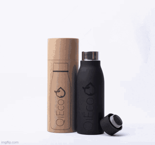 a black tote bag made of recycled plastic bottles has a pen and notebook in the pocket