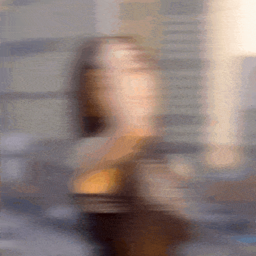 a blurry picture of a woman 's face is shown