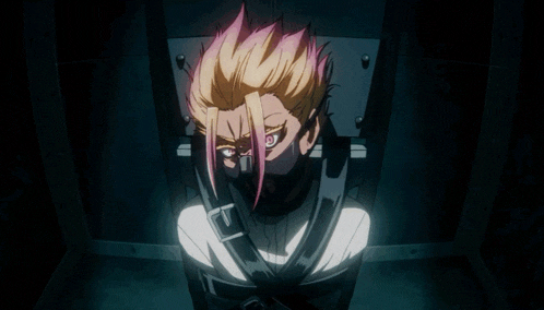 a man with blonde hair is tied up in a chair with a mask on his face