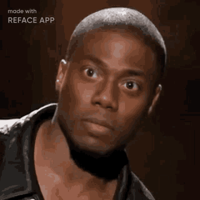 a man in a leather jacket is making a funny face while looking at the camera .