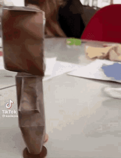 a tiktok video shows a person standing on a stack of coins