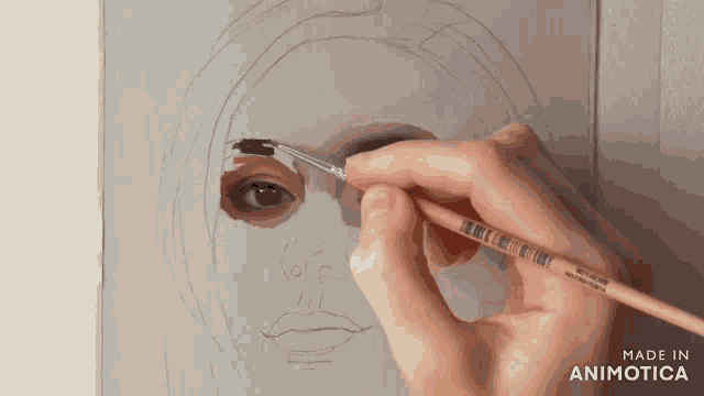 a person is painting a woman 's face with a brush that says made in animatica