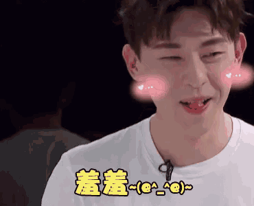 a man in a white shirt with chinese characters on his face