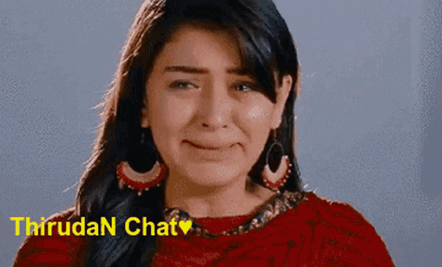a woman in a red top is crying with the words thiruda n chat written above her