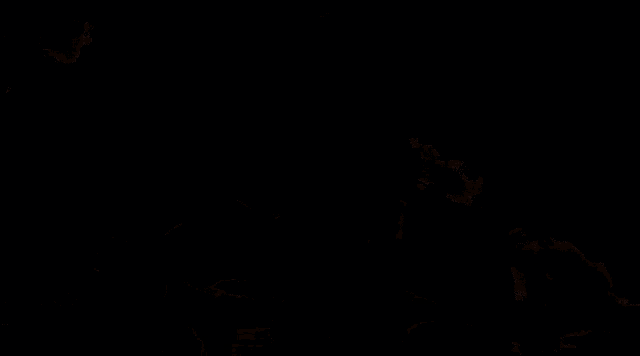 a silhouette of a woman doing a handstand in front of a smokey background