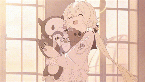 a girl is holding a penguin and a bear
