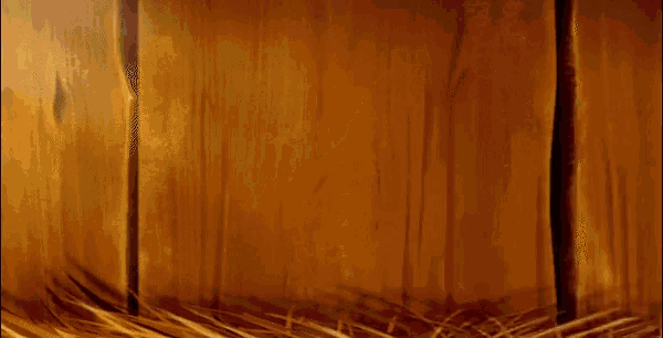 a cartoon bird is standing in a nest with a wooden wall behind it .