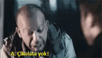 a man is talking to another man in a dark room and says açikolata yok !