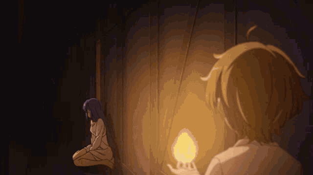 a man and a woman are standing next to each other in a dark room with a light shining on them