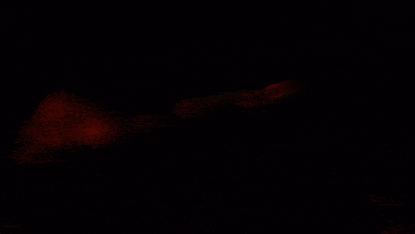 a black background with red smoke coming out of the bottom right corner