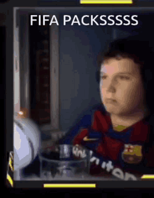 a boy wearing a barcelona jersey is sitting in front of a window