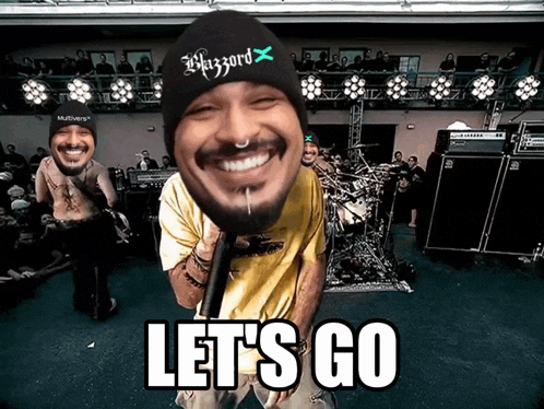 a man holding a microphone with the words let 's go written below him