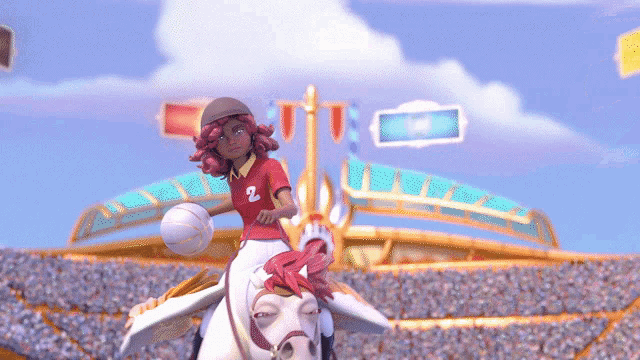 a girl riding a horse has the number 2 on her shirt