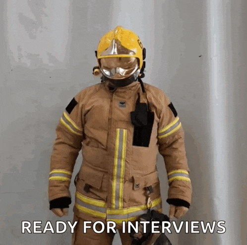 a fireman wearing a helmet and gloves is ready for interviews