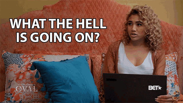 a woman sitting on a bed with a laptop that says bet