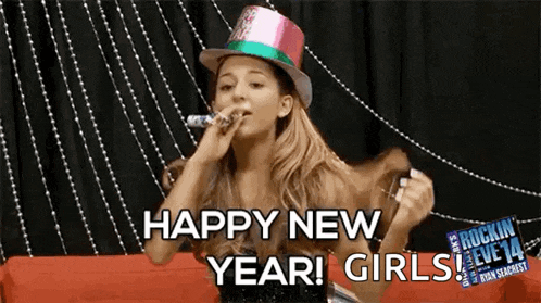 ariana grande is wearing a party hat and blowing a party horn while saying happy new year !