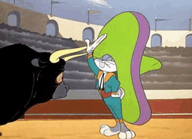 bugs bunny is wearing a sombrero and standing next to a bull in a bullfight .
