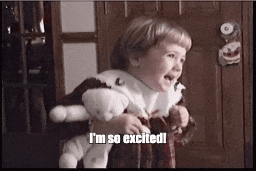 a little girl is holding a teddy bear and saying `` i 'm so excited ! ''