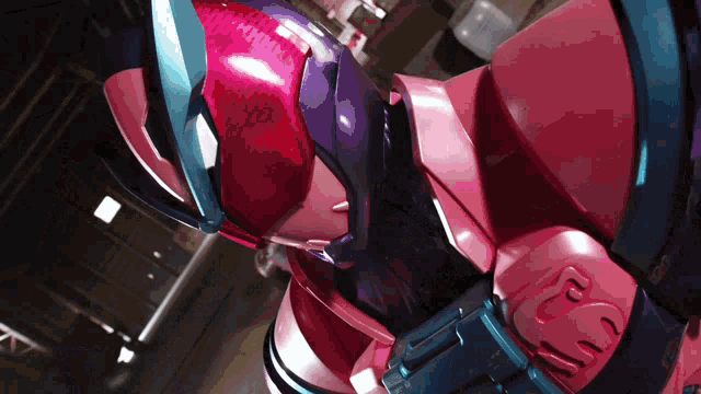 a pink and purple robot with the number 2 on it 's chest