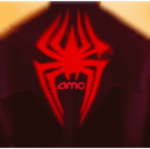 a purple jacket with a red spider on it .